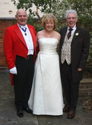 English Toastmaster Garry Smith with a bride and groom
